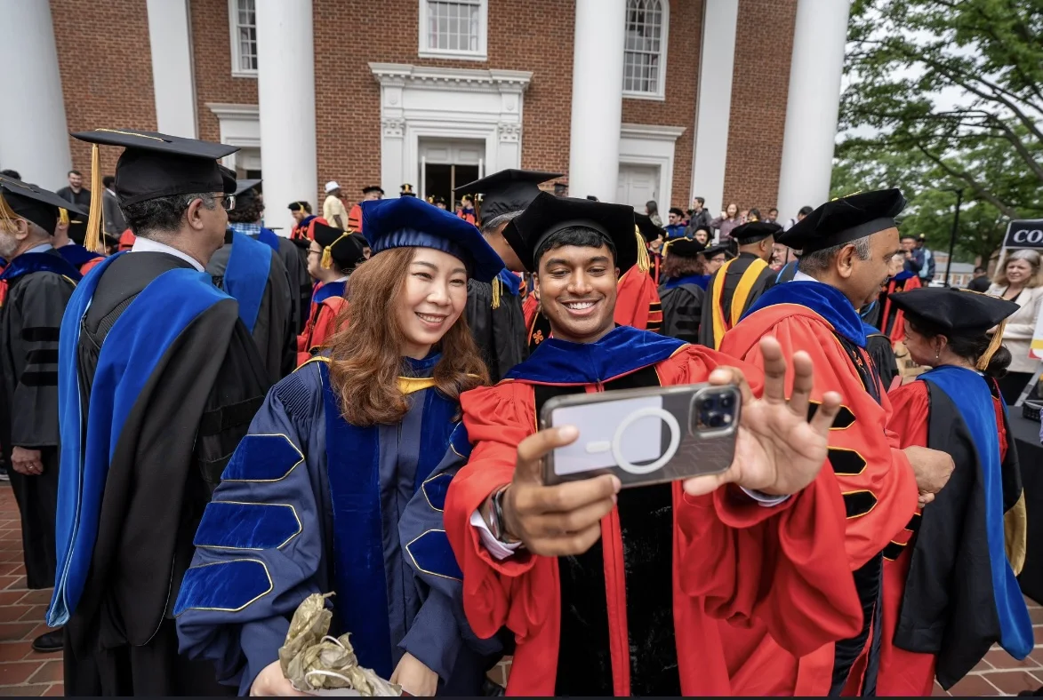 Furong Huang celebrating with a graduate at University of Maryland commencement