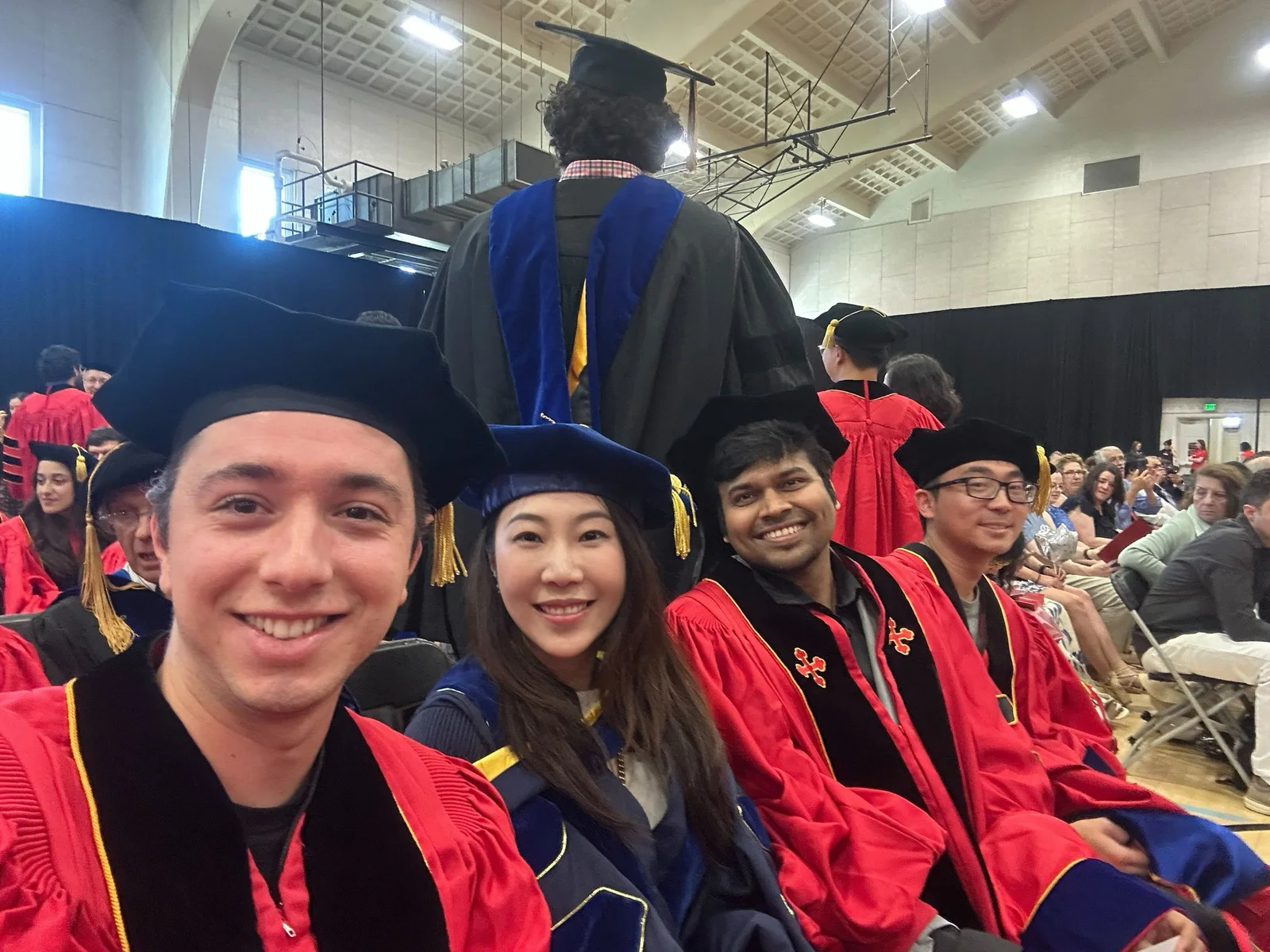 Furong Huang with graduates at University of Maryland commencement