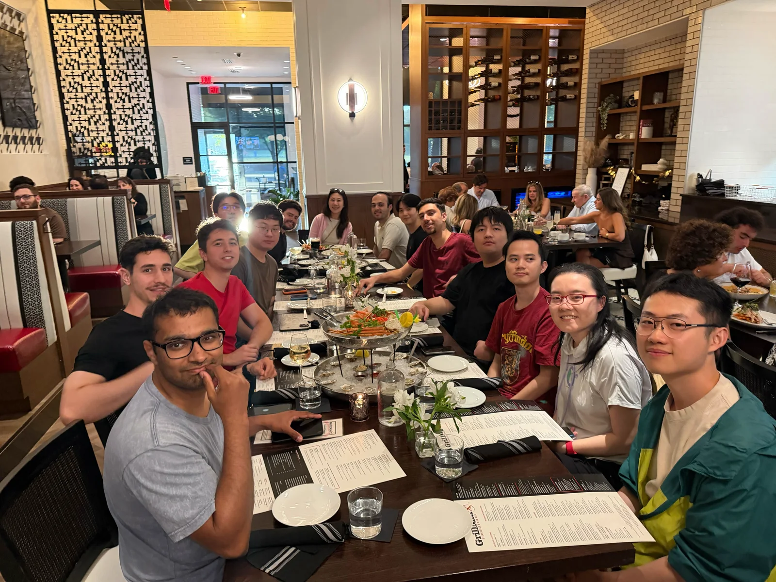 Furong Lab members gathered around a table for dinner