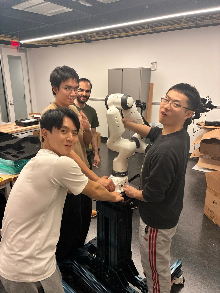 Researchers setting up a robot in the laboratory