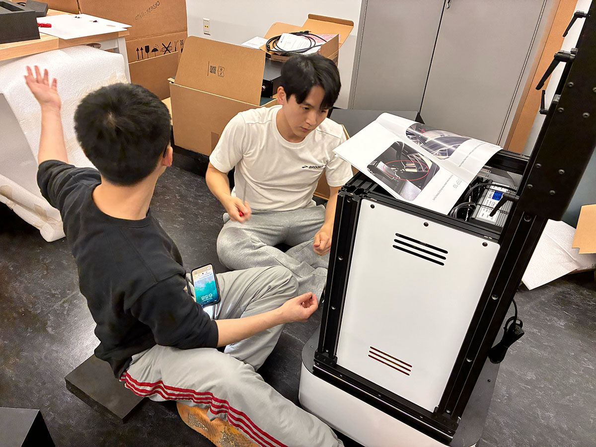 Furong Lab researchers assembling robotics equipment in the laboratory