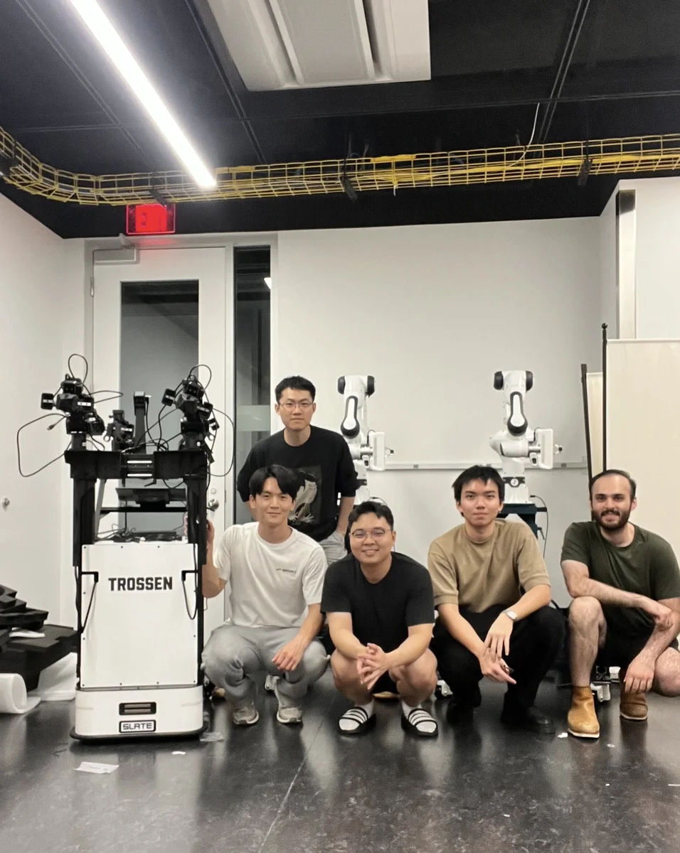 Furong Lab researchers with two Franka Research 3 robot arms and a mobile robot platform