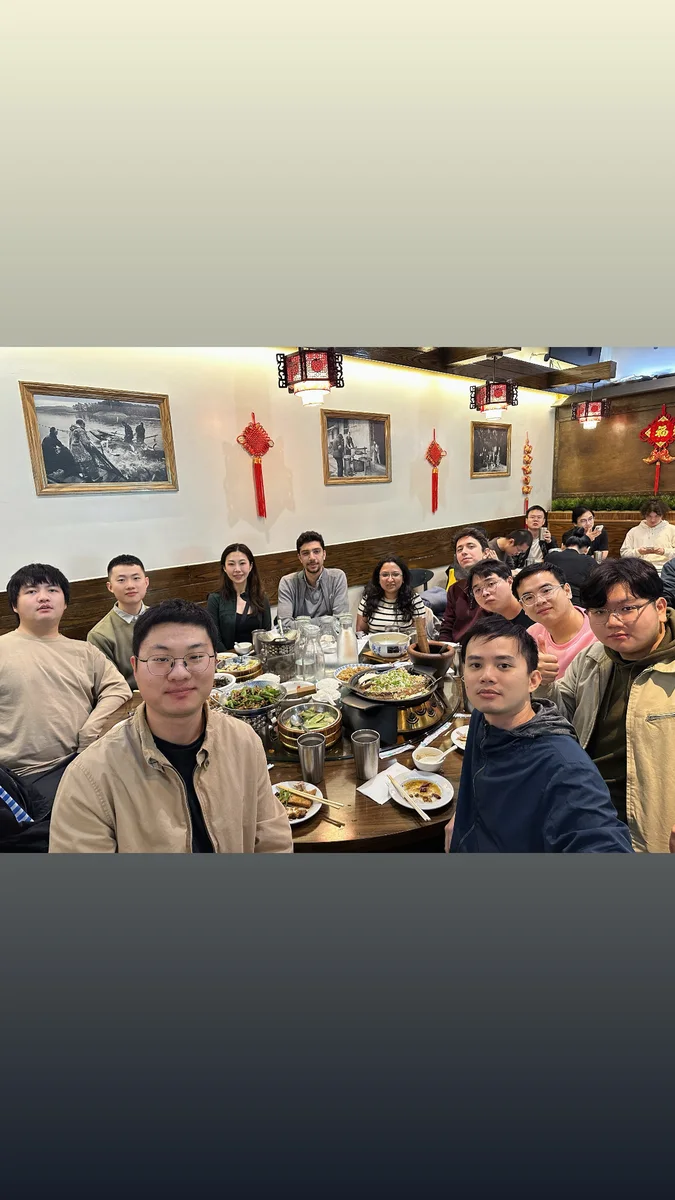 Furong Lab members smiling together at dinner